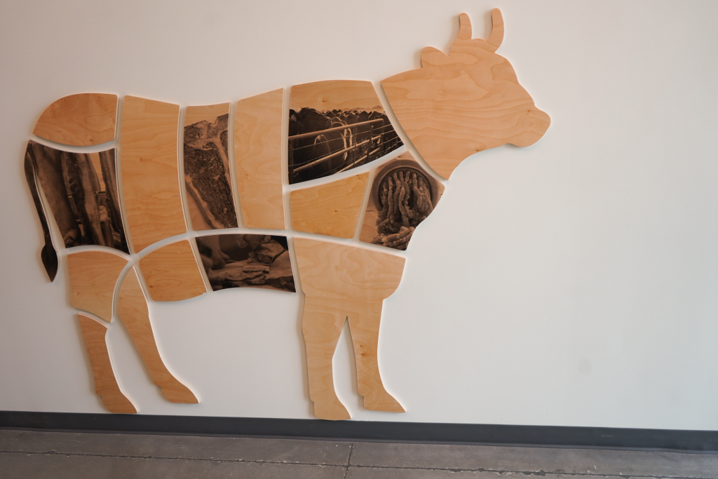 Cow on wall.
