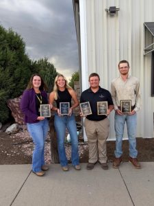 Ella Goldinger, Katie Bernicky, Austin Wilson and Jacob Heitman smile and hold award plaques at 2026 NCWSS Competition.