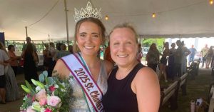 Tess Bauer (left) smiles next to woman in her 2025 St. Charles County Fair Queen sash and crown.