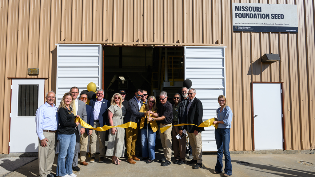 Group cuts ribbon at Missouri Foundation Seed building.