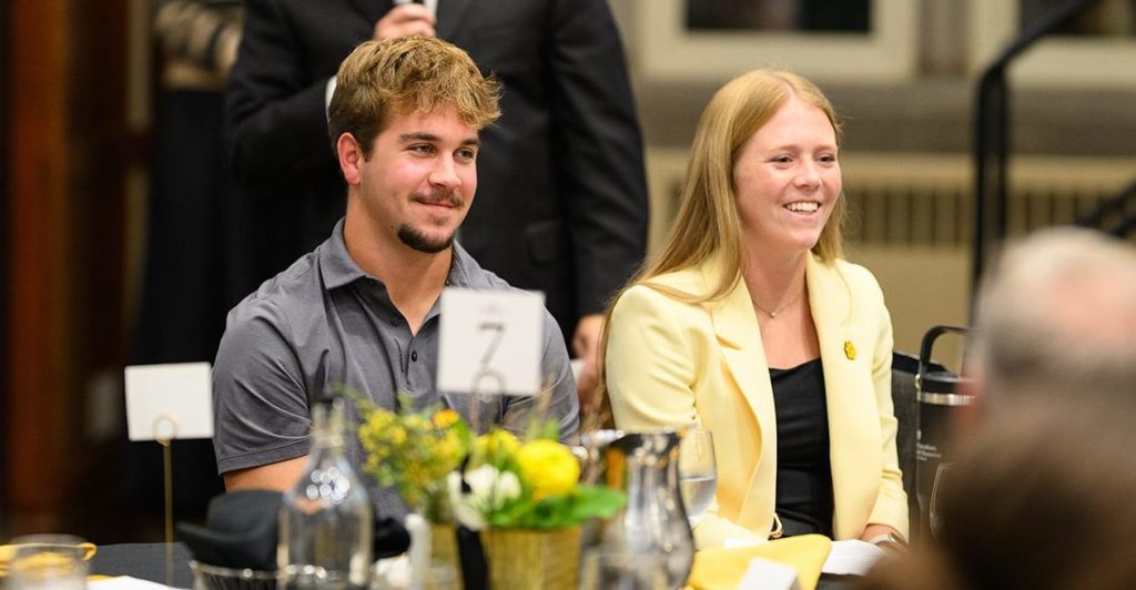 TJ and Andi Belt smile at dinner table during CAFNR Scholarship Dinner.