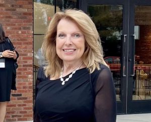 Linda Geist in a black dress outside the Atrium, where the Hall of Fame awards were celebrated.