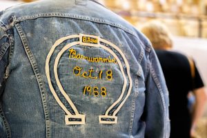 The back of a denim jacket with Barnwarmin' 1968 embroidered on it.
